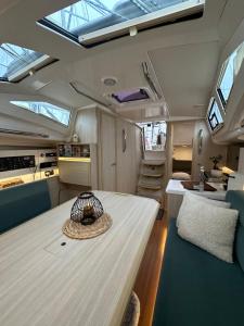 a kitchen and living room with a table and skylights at La Rochelle sur L'eau in La Rochelle