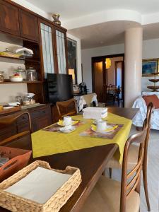 a kitchen and dining room with a table and chairs at Art and Sea B&B in Pedaso