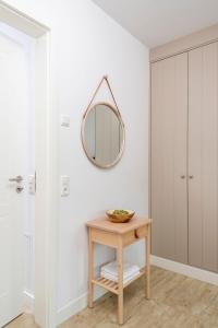 a bathroom with a table and a mirror on the wall at Alte Waescherei _9463_ in List