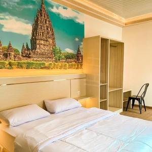 Postel nebo postele na pokoji v ubytování Kartiko Palagan Eksklusif Yogyakarta