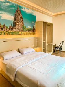 Postel nebo postele na pokoji v ubytování Kartiko Palagan Eksklusif Yogyakarta + 24 fotografií