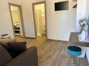 a living room with a couch and a table at Villa Azzurra in Lampedusa