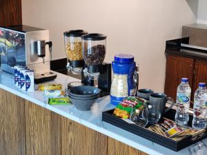 a kitchen counter with some food and a blender at Downtown Oasis, Burj Khalifa Views, Luxury Amenities in Dubai