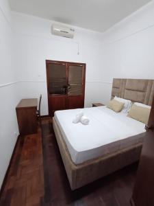 מיטה או מיטות בחדר ב-Apartamento aconchegante