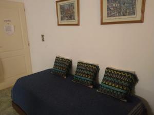 a bedroom with a bed with two pillows on it at Departamento Mirasol in Federación