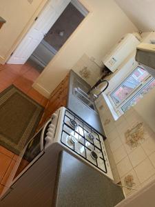 an overhead view of a kitchen with a stove at Nice 4 bedroom house in Nottingham