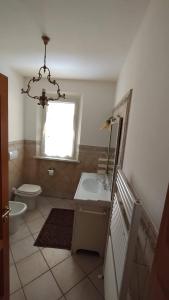 a bathroom with a sink and a toilet and a window at Villa Incanto in Forte dei Marmi +42 photos