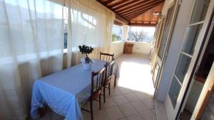 a table with a vase of flowers on it in a room at Villa Incanto in Forte dei Marmi