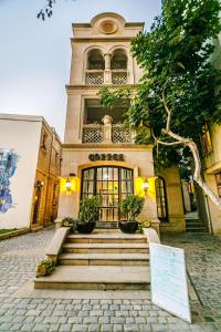 a building with a sign in front of it at Coffee time hotel in Baku