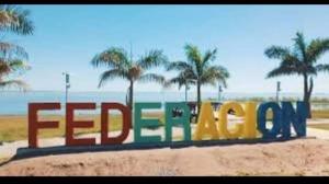 a sign that says fedex on the beach at Edificio Mirasol 3 in Federación