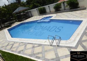 a swimming pool with a sign that reads mauldinsville at Prime Nomads in Kisumu
