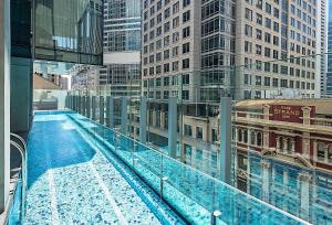 a view of a swimming pool on a building at Sydney CBD Luxury Furnished Apartment & City Views in Sydney