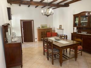 a dining room with a table and some chairs at B&B All’Ombra della Torre in Fabrica di Roma +22 photos