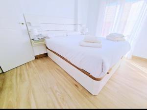 Łóżko lub łóżka w pokoju w obiekcie Apartamento Puerto Sol y Mar