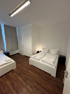 Postel nebo postele na pokoji v ubytování Potsdamer Inn