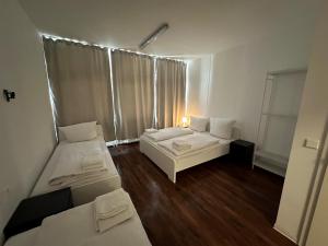 Postel nebo postele na pokoji v ubytování Potsdamer Inn + 2 fotografie