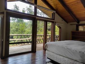 Postel nebo postele na pokoji v ubytování Tumuñan Lodge