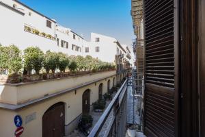 a view from a balcony of a street with buildings at Hola House alla Kalsa in Palermo