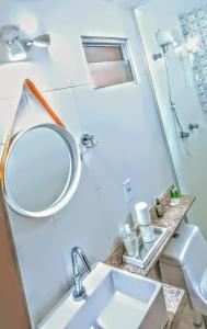 a bathroom with a sink and a mirror at Mar Turquesa Eco Pousada in Maragogi +73 photos