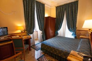Кровать или кровати в номере Hotel Palladium Palace