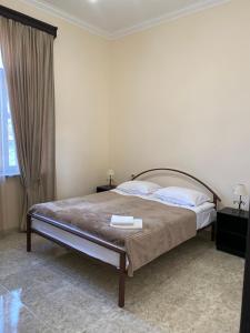 Postel nebo postele na pokoji v ubytování Yan Guest House