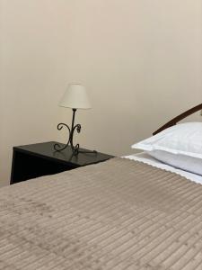 Postel nebo postele na pokoji v ubytování Yan Guest House