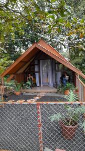 a small house with people sitting in it at Villa campo's in Venecia