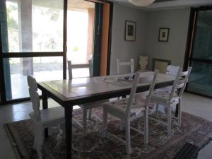 a dining room with a wooden table and chairs at Villa Formica - Vista su Castello di Gradara in Gradara