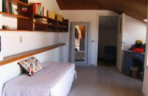 a bedroom with a bed with a pillow on it at Villa Formica - Vista su Castello di Gradara in Gradara
