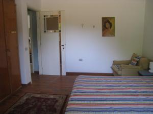 Postel nebo postele na pokoji v ubytování Villa Formica - Vista su Castello di Gradara + 3 fotografie