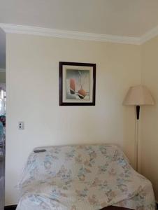 Casa à Beira-Mar próxima ao centro de Rio das Ostrasにあるベッド