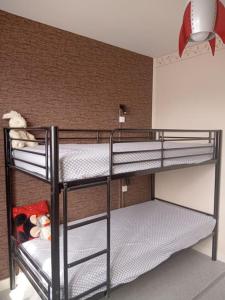 a bunk bed room with two bunk beds in a room at Le Vintage 14 in Bayeux