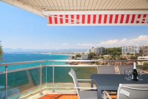 a balcony with a table and a view of the ocean at UHC Bahia Family Complex in Salou +26 photos
