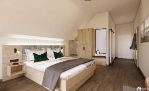 a bedroom with a large bed with green pillows at Haus Weitblick by Spinnerhof in Sasbachwalden