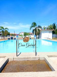 a swimming pool with a sign that reads casa cabral at Casa Gabriel in Marilao in Marilao
