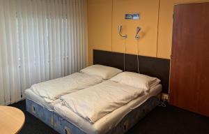 Postel nebo postele na pokoji v ubytování Penzion U Remízky