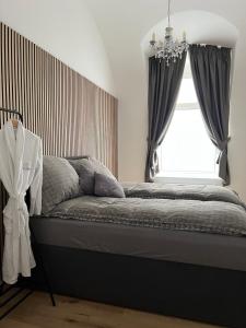 a bedroom with a large bed with a window at Beatrix Home Vienna Luxury Stay in Vienna