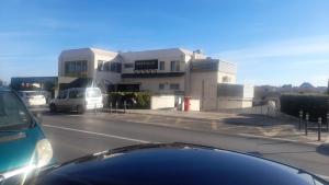 a car parked in front of a building at Apartmani Nika Marangun in Dubrovnik