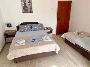 Postel nebo postele na pokoji v ubytování Guesthouse Civovic