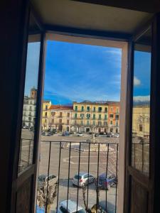 a view of a parking lot from a window at La Casetta In Piazza in Sulmona