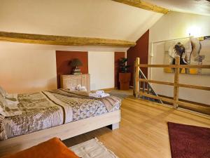 a bedroom with a bed with a horse on the wall at maison de ville avec jardin privatif in Nevers