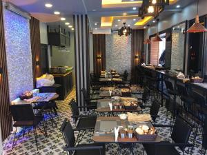 a restaurant with tables and chairs and a bar at Bonita Hotel in Istanbul +34 photos