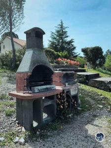 an old brick oven sitting in the grass at St-Germain - Les Terrasses de l'Ardèche - Piscine in Salavas +30 photos