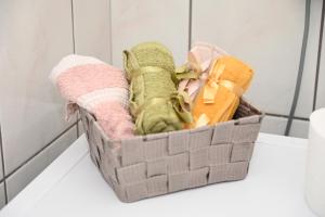 a basket filled with towels and toys on a counter at Aurora Studio Apt for Couples & Friends in Heraklio Town