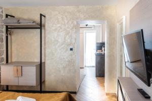 a room with a kitchen and a living room at L&B amphitheater apartments in Pula