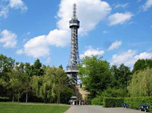 a view of the eiffel tower from a park at Hotel U Kříže in Prague