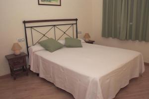 Postel nebo postele na pokoji v ubytování Apartamentos Cal Ratero + 18 fotografií