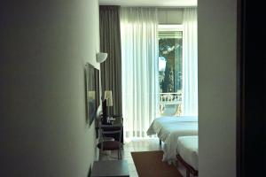 Voodi või voodid majutusasutuse Hotel L'Approdo toas