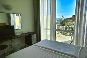Voodi või voodid majutusasutuse Hotel L'Approdo toas