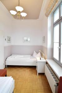 Ein Bett oder Betten in einem Zimmer der Unterkunft Villa Schering App. EG links